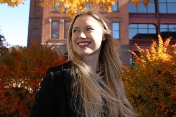Commonwealth University of Pennsylvania student smiles on the Mansfield campus in North Central Pennsylvania in the fall