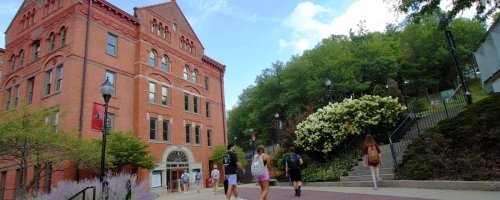 Commonwealth University of Pennsylvania Mansfield, formerly Mansfield University of Pennsylvania, North Hall Library with students walking on the Northern PA campus