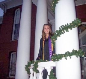 Lauren Conston '07 stands on the porch of Carver Hall on graduation night.