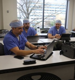 DNP Nurse Anesthesia Students working on a lap top