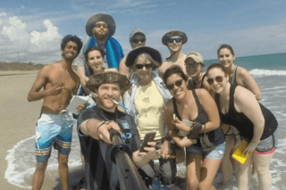 A group of people on a beach. 