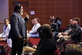 A man talking to a group.