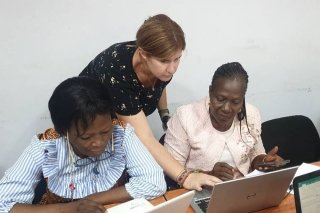 Three women looking at computers.