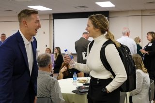 A girl and a guy talking. 