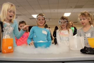 Kids playing with bubbles.