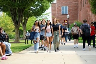 A group of students walking on campus.