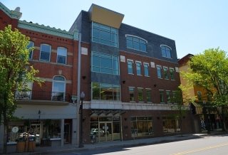 Brick building with a lot of windows: The Greenly Center.