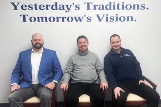Three BU alumni in the Scott Township office of First Keystone Community Bank. From left are commercial loan officers Chris Matthews '14, Curtis Snowden  '16/'18M, and credit department manager, Brian Klinefelter '07 '