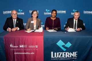 Shown are, from left  — Thomas Fletcher, senior advisor to the president for strategic partnerships, Commonwealth University of PA; Dr. Diana Rogers-Adkinson, provost and senior vice president for academic affairs, Commonwealth University of PA; Dr. Rosana Reyes, vice president, enrollment management and student affairs, LCCC; and Thomas P. Leary, president, LCCC.