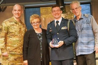 Cadet Alec Leese Honored. Left to right: Maj. Michael Adams, Sandra Adams, Cadet Alec Leese, Sgt. Maj. (retired) Michael Adams  