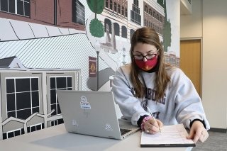 A girl doing schoolwork. 