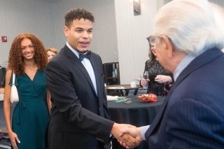 Two men shaking hands.