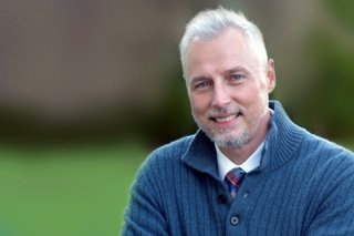 A headshot of a man.