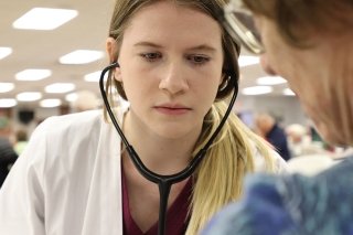 A girl with stethoscope. 