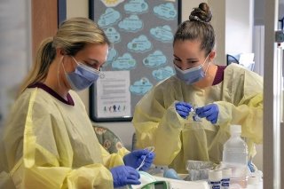 Two nurses working together. 