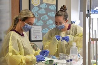 Two nurses working together.