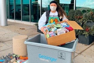 A person packing boxes. 