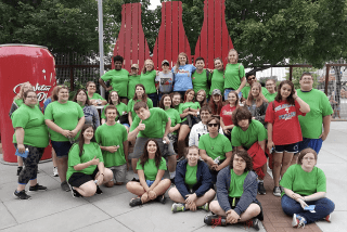 A group together, all wearing green.