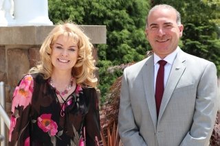 A man and a woman standing next to each other. 