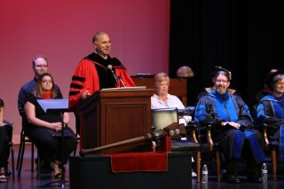 The president of CU at Mansfield Convocation. 