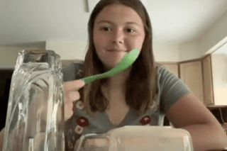 A girl eating.