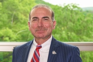 A headshot of the University President. 