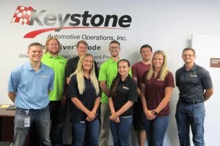 A group of people standing together in Keystone Auto.