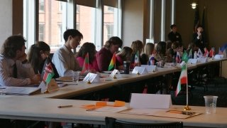 A group of people sitting at a table. 