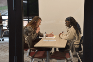 Lauren Conston '07 sits with a student during a mock interview during the Commonwealth Eileen G. Jones Honors College first Professional Development Day