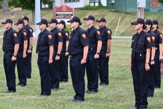 Mansfield Police Academy Cadets stand at attention during ceremony