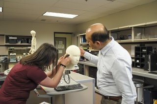 An Audiology and Speech Language Pathology student at CU-Bloomsburg getting instruction from a faculty expert