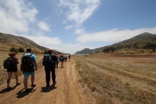 Environmental, Geographical, and Geological (EGGS) students walking along a trail in California as part of their academic program at CU