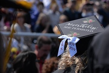 a nursing graduate wearing a decorative graduation cap