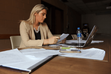 A woman working at a desk.