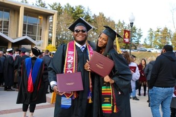 Graduation photo of two people. 