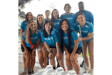 A group of people. They are all wearing blue. 