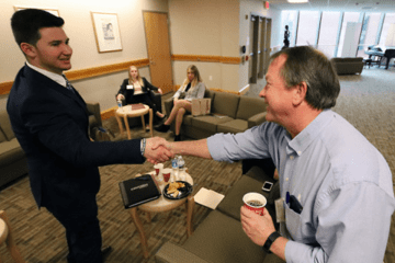 Two men shaking hands. 