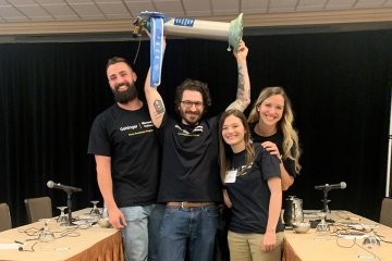 BU's winning team members:  left to right: Matthew Moore, Matthew Homishak (holding oxygen tank trophy), Ciana Rollman, Elise Slaughter (in back).