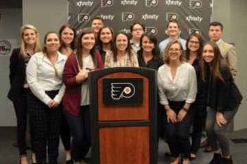 A group of people standing behind a podium.