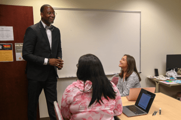 A man teaching a class. 