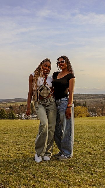 Roommates pose for a pic during a spring sunset at Commonwealth University-Mansfield, formerly Mansfield University.