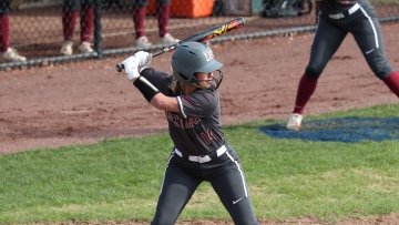 Bella Schmitt batting. 