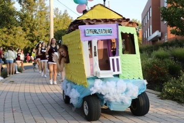 A golf cart that is decorated. 