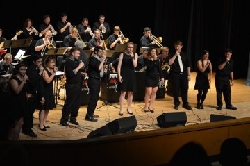 Musicians performing on stage. 