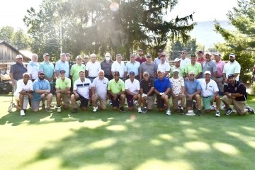 A picture of a group of golfers. 