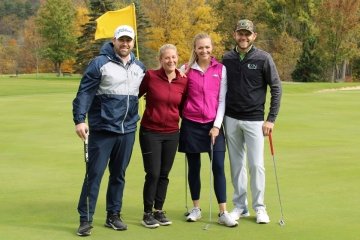 Mansfield alumni pose during alumni golf tournament.