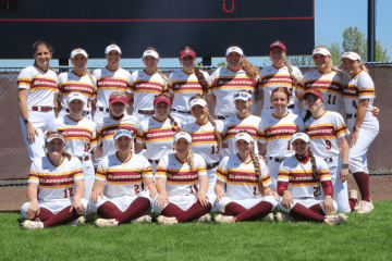 Photo of 2024 Bloomsburg softball team in three rows, wearing white uniform shirts and maroon pants