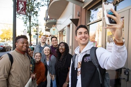 Friends from Commonwealth University-Bloomsburg, formerly Bloomsburg University, gather for a quick selfie downtown Bloomsburg.