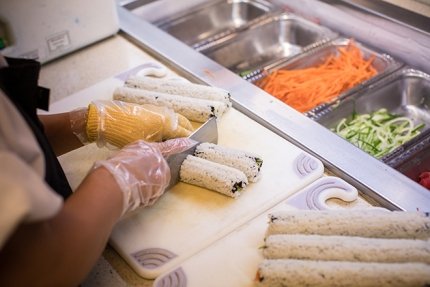 Chef at Commonwealth University-Bloomsburg, formerly Bloomsburg University, finishes preparation of sushi at the Scranton Commons.