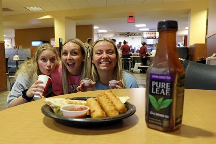 Friends stop for a quick photo while eating lunch at Lower Bentley at Commonwealth University-Lock Haven, formerly Lock Haven University.